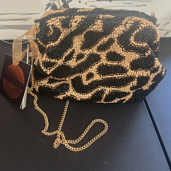 From India to you cheetah beaded clutch and gold crossbody chain bag